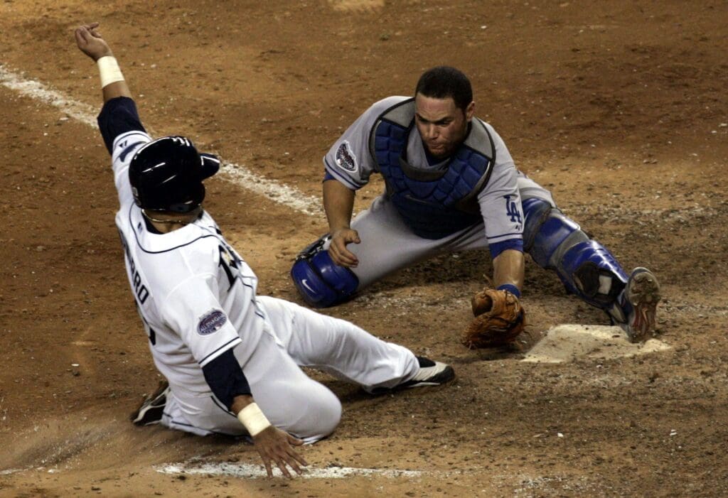 American League Dioner Navarro is tagged out at the plate by National League catcher Russell Martin after trying to score from second in the 11th inning during the 79th MLB All-Star Game at the old Yankee Stadium in the Bronx July 15, 2008. The American League won the game 4-3 in the 15th inning of a game that took just under 5 hours to play.