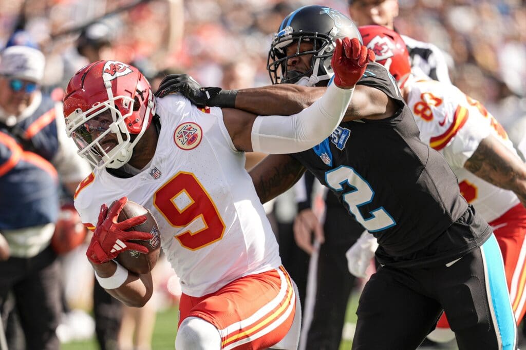 Nov 24, 2024; Charlotte, North Carolina, USA; Kansas City Chiefs wide receiver JuJu Smith-Schuster (9) is pushed out of bounds by Carolina Panthers cornerback Michael Jackson (2) during the first quarter at Bank of America Stadium. Mandatory Credit: Jim Dedmon-Imagn Images