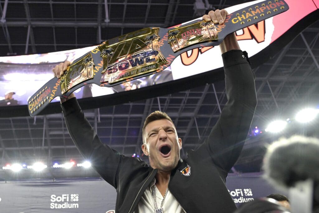 Dec 18, 2024; Inglewood, CA, USA; Rob Gronkowski holds the championship belt after the UNLV Rebels defeated the California Golden Bears in the LA Bowl at SoFi Stadium. Mandatory Credit: Jayne Kamin-Oncea-Imagn Images