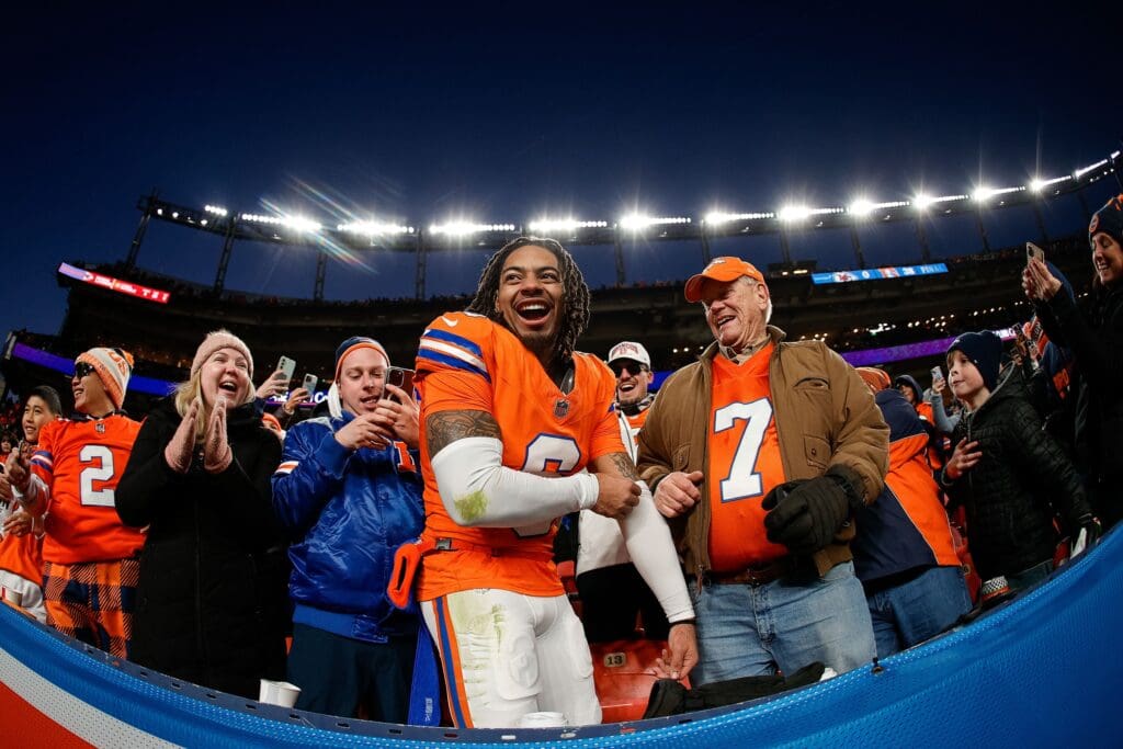 Jan 5, 2025; Denver, Colorado, USA; Denver Broncos safety P.J. Locke (6) celebrates with fans after the game against the Kansas City Chiefs at Empower Field at Mile High. Mandatory Credit: Isaiah J. Downing-Imagn Images