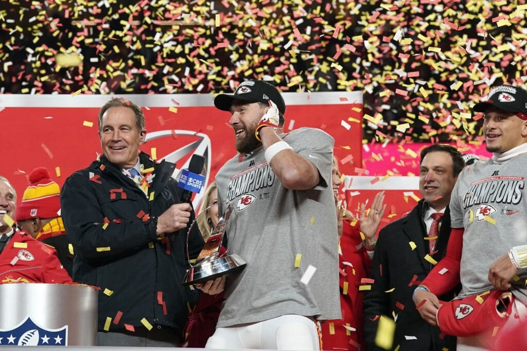 Jan 26, 2025; Kansas City, MO, USA; Kansas City Chiefs tight end Travis Kelce (87) speaks to the media after being presented with the Lamar Hunt Trophy after the AFC Championship game against the Buffalo Bills at GEHA Field at Arrowhead Stadium. Mandatory Credit: Denny Medley-Imagn Images