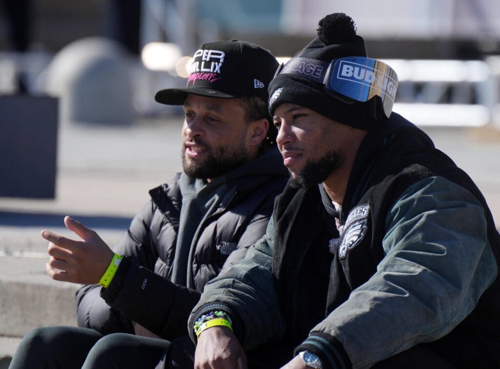 Feb 14, 2025; Philadelphia, PA, USA; Philadelphia Eagles running back Saquon Barkley (right) and Philadelphia Eagles cornerback Avonte Maddox (left) during the Super Bowl LIX championship parade and rally. Mandatory Credit: Kirby Lee-Imagn Images