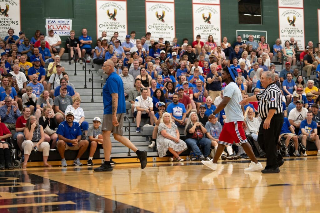 Greg Ostertag gets walked off the court during The Rock Chalk Roundball Classic Thursday, July. 10, 2025 at Free State High School.