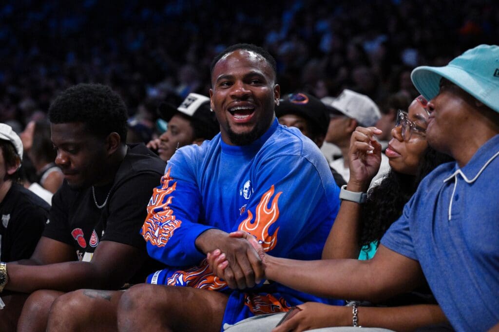 Jul 16, 2025; Brooklyn, New York, USA; Dallas Cowboys star Micah Parsons looks on during the second half of the game between the New York Liberty and the Indiana Fever at Barclays Center. Mandatory Credit: John Jones-Imagn Images