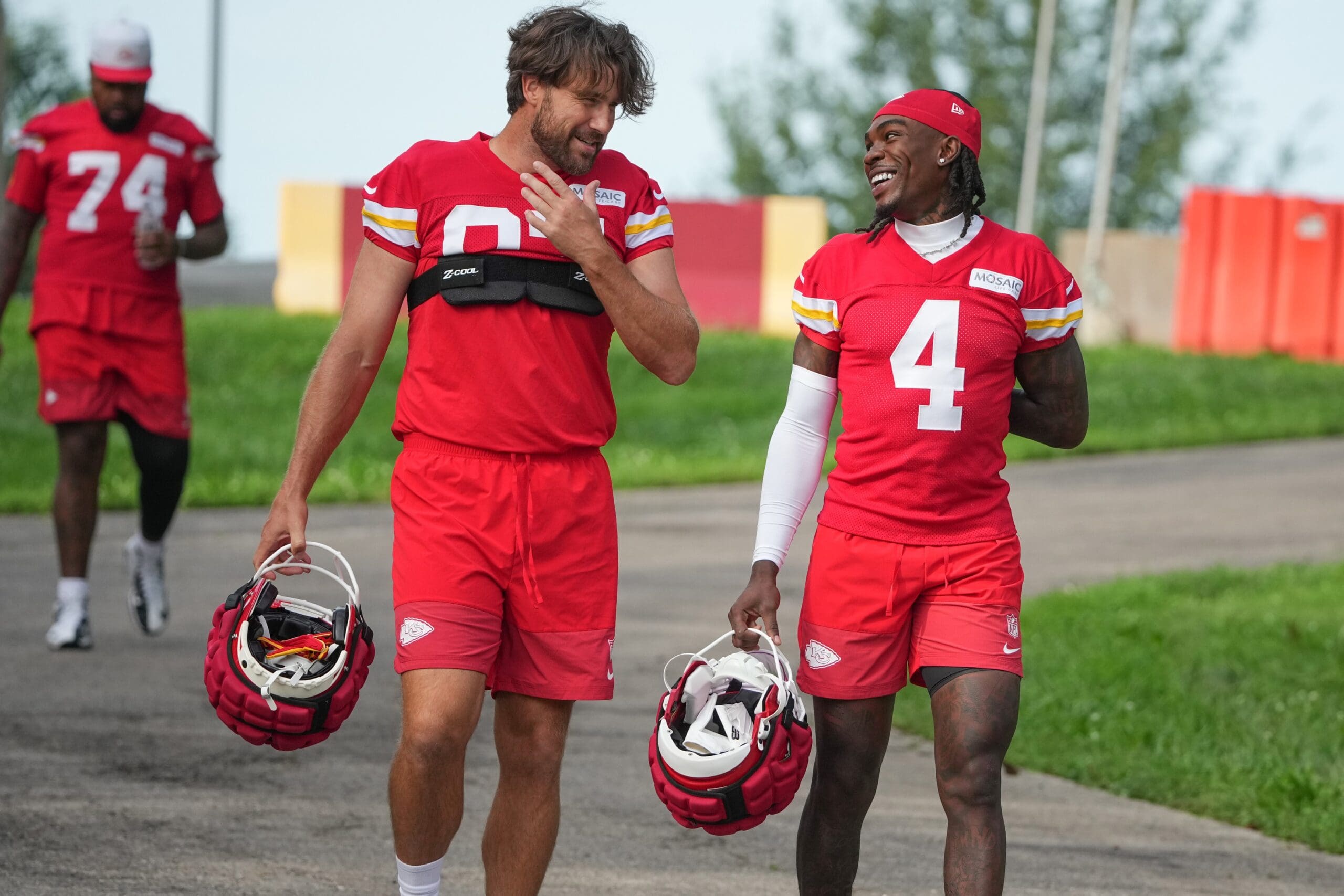 Jul 22, 2025; St. Joseph, MO, USA; Kansas City Chiefs tight end Travis Kelce (87) and wide receiver Rashee Rice (4) walk down the hill to the fields prior to training camp at Missouri Western State University. Mandatory Credit: Denny Medley-Imagn Images