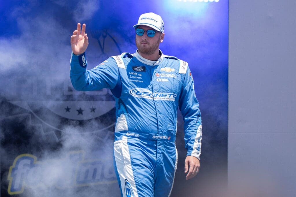 Jul 12, 2025; Sonoma, California, USA; NASCAR Xfinity Series driver Austin Hill (21) waves after being introduced to fans before the start of the NASCAR Xfinity Series Race at Sonoma Raceway. Mandatory Credit: Stan Szeto-Imagn Images