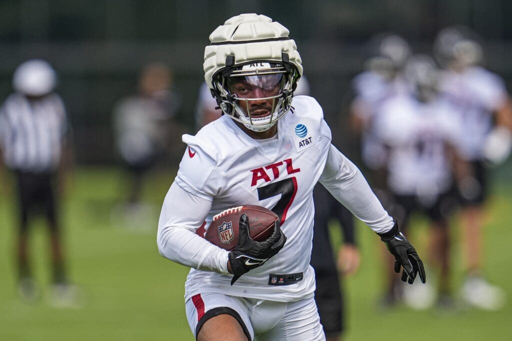Jul 24, 2025; Flowery Branch, GA, USA; Atlanta Falcons running back Bijan Robinson (7) runs with the ball during training camp at IBM Performance Field. Mandatory Credit: