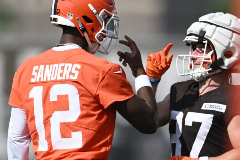 Jul 26, 2025; Berea, OH, USA; Cleveland Browns quarterback Shedeur Sanders (12) celebrates with wide receiver Luke Floriea (37) during training camp at CrossCountry Mortgage Campus. Mandatory Credit: Ken Blaze-Imagn Images