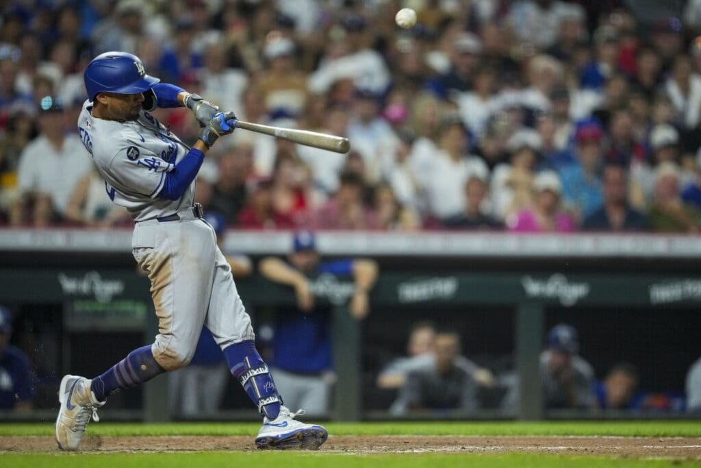 Jul 29, 2025; Cincinnati, Ohio, USA; Los Angeles Dodgers shortstop Mookie Betts (50) singles against the Cincinnati Reds in the seventh inning at Great American Ball Park. Mandatory Credit: Aaron Doster-Imagn Images
