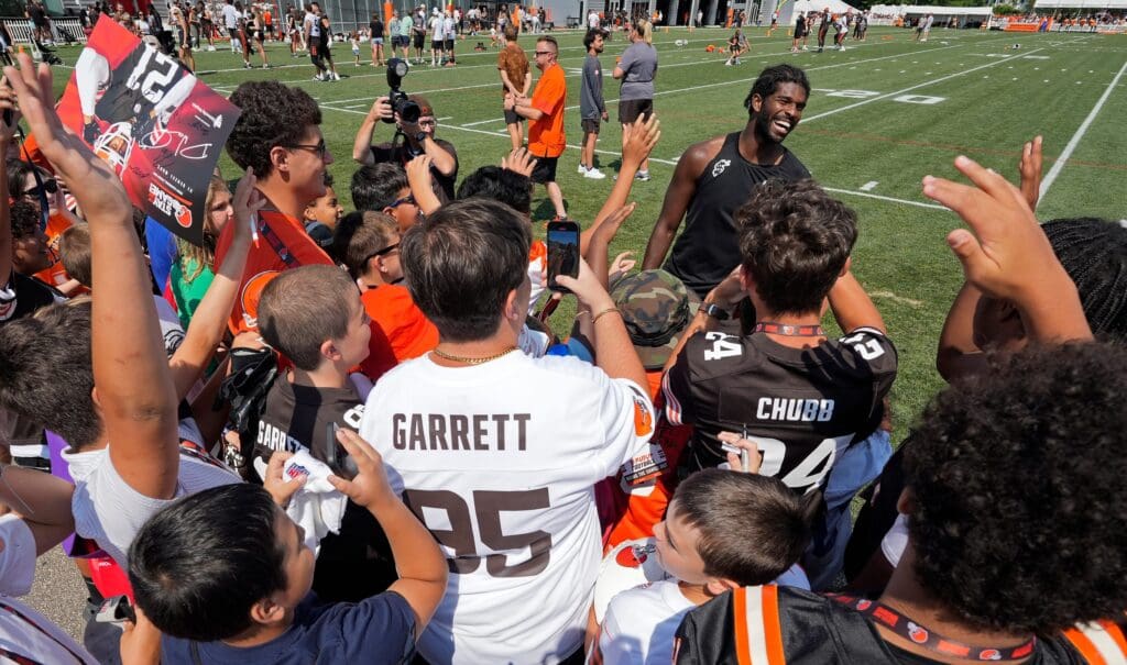 Cleveland Browns quarterback Shedeur Sanders (12) is all smiles as he meets fans after day eight of NFL training camp at CrossCountry Mortgage Campus, Friday, Aug. 1, 2025, in Berea, Ohio.
