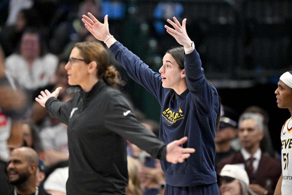 Aug 1, 2025; Dallas, Texas, USA; Indiana Fever head coach Stephanie White and guard Caitlin Clark (22) react to a call during the first half against the Dallas Wings at the American Airlines Center. Mandatory Credit: Jerome Miron-Imagn Images
