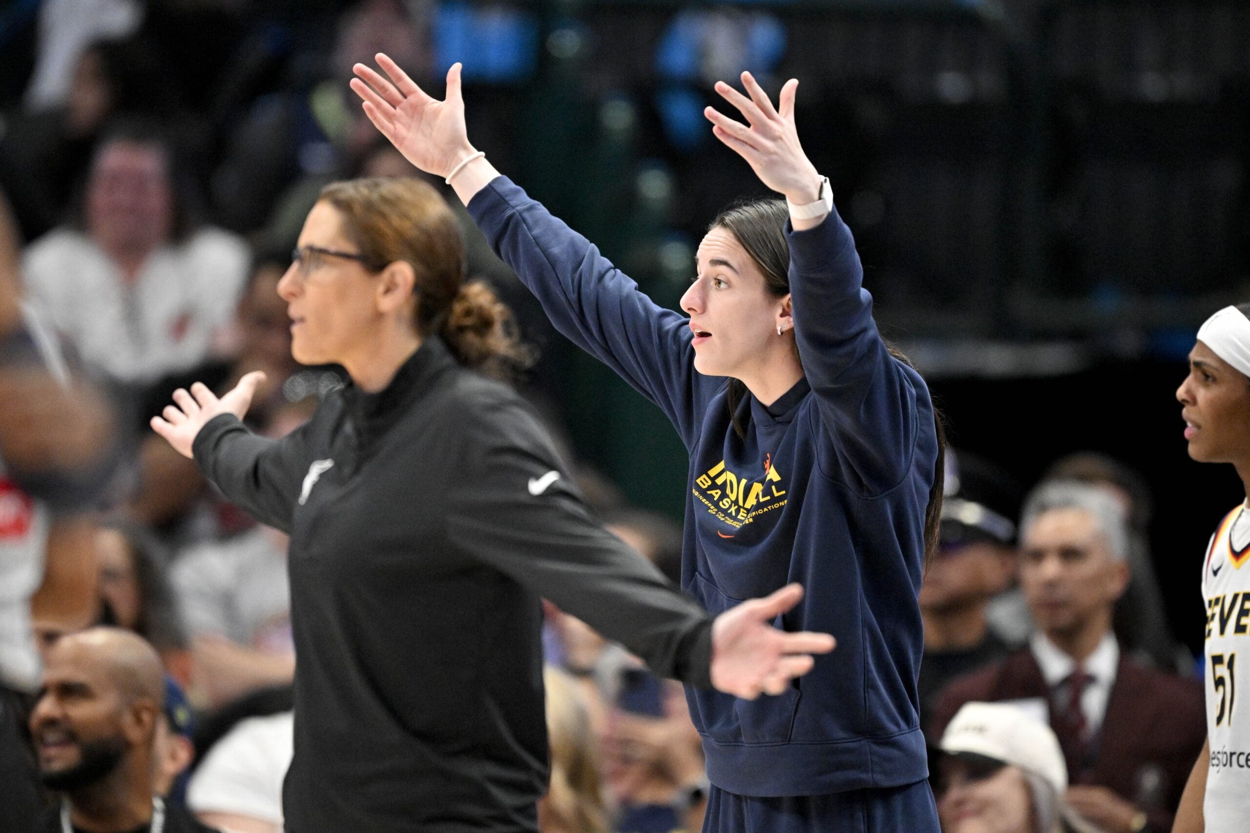 Aug 1, 2025; Dallas, Texas, USA; Indiana Fever head coach Stephanie White and guard Caitlin Clark (22) react to a call during the first half against the Dallas Wings at the American Airlines Center. Mandatory Credit: Jerome Miron-Imagn Images