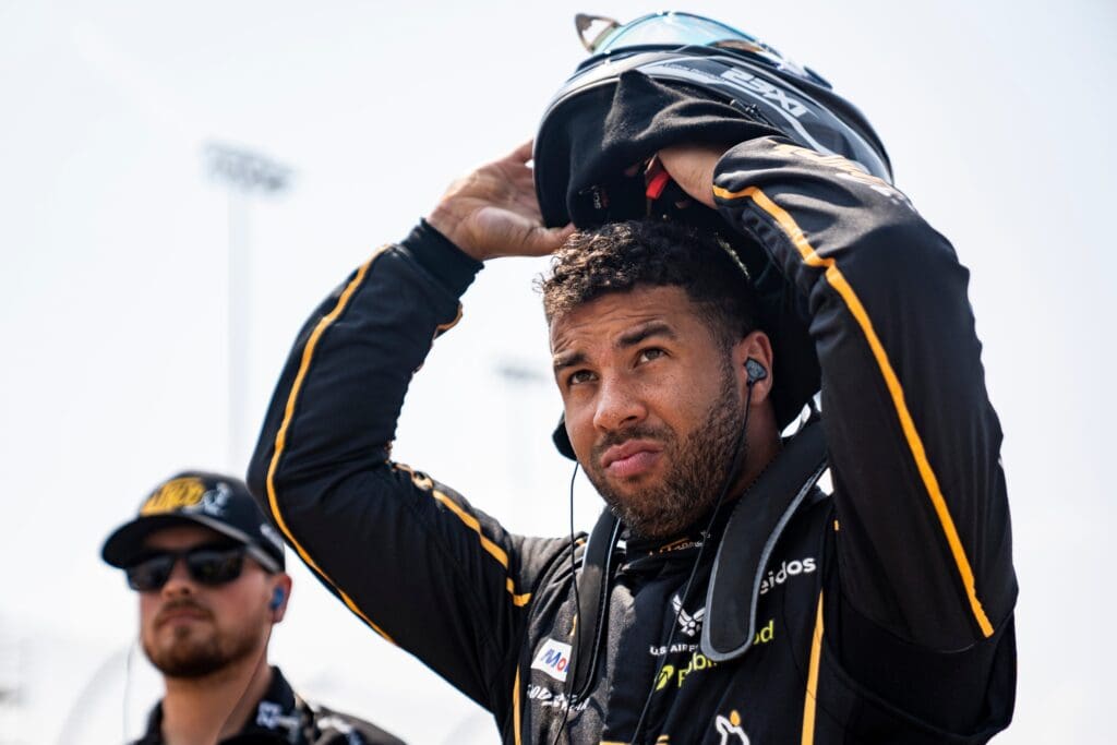 Bubba Wallace (23) puts on his helmet during NASCAR Cup Series qualifying on Aug. 2, 2025, at Iowa Speedway in Newton, Iowa. Chase Briscoe (19) qualified on the pole.