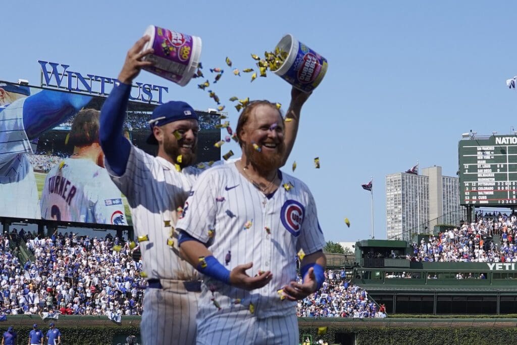 Aug 3, 2025; Chicago, Illinois, USA; Chicago Cubs pinch hitter Justin Turner (3) celebrates his two-run game winning home run with first baseman Michael Busch (29) against the Baltimore Orioles during the ninth inningat Wrigley Field. Mandatory Credit: David Banks-Imagn Images