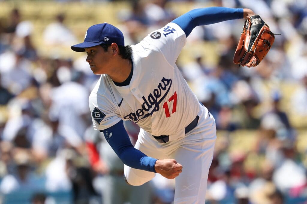 Aug 6, 2025; Los Angeles, California, USA; Los Angeles Dodgers two-way player Shohei Ohtani (17) pitches in the third inning against the St. Louis Cardinals at Dodger Stadium. Mandatory Credit: Kiyoshi Mio-Imagn Images