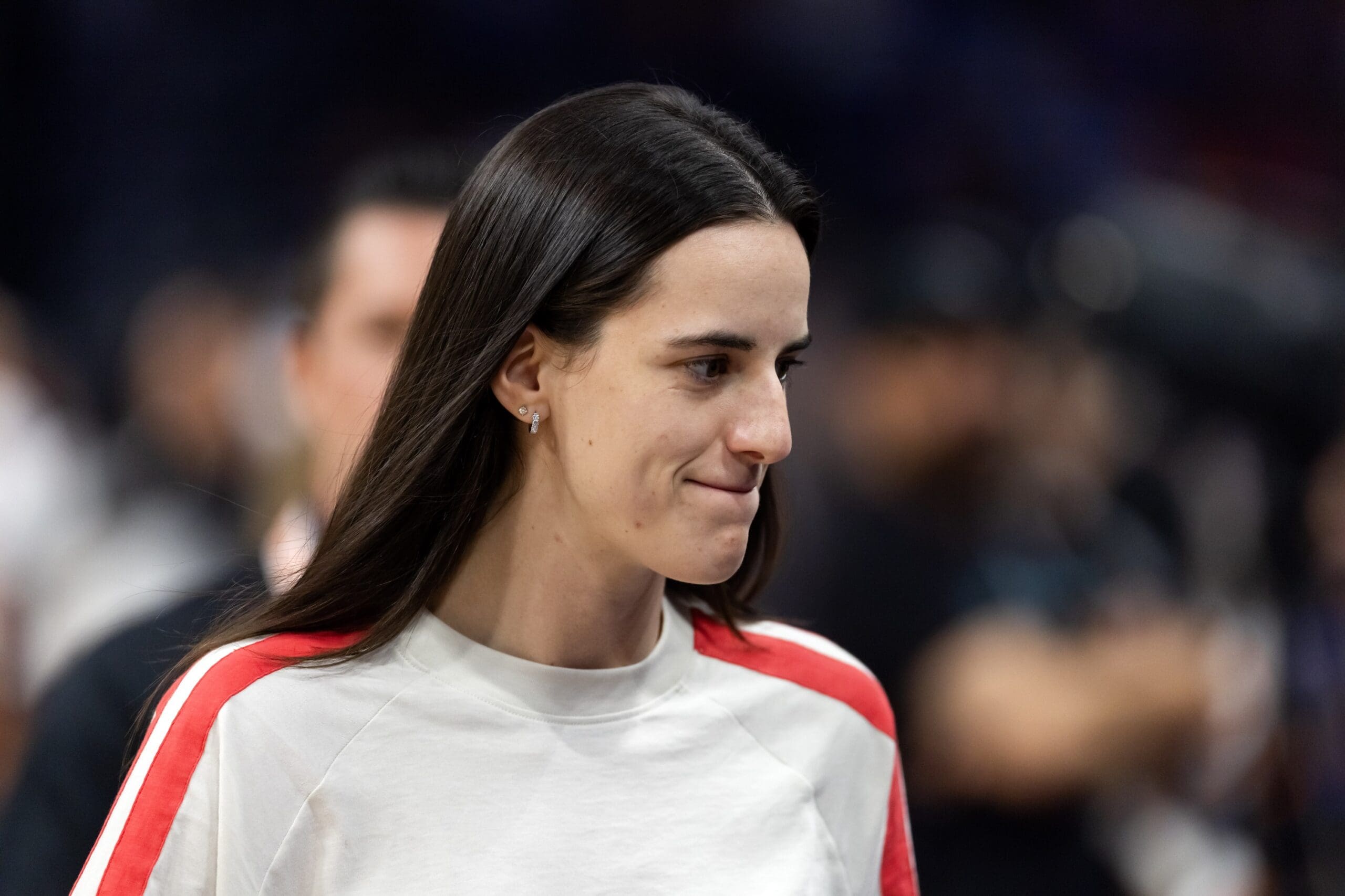 Aug 7, 2025; Phoenix, Arizona, USA; Indiana Fever injured guard Caitlin Clark in attendance against the Phoenix Mercury during an WNBA game at PHX Arena. Mandatory Credit: Mark J. Rebilas-Imagn Images