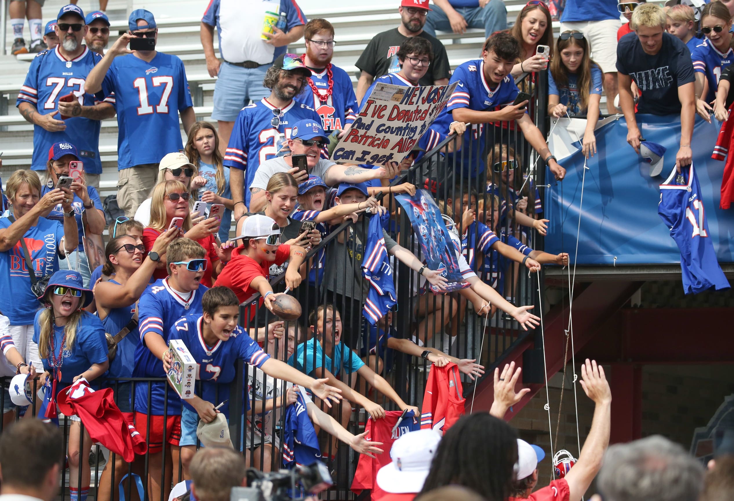 Fans scream out in hopes of getting an autograph as Bills star quarterback Josh Allen waves as he leaves the field for the last time during the final day of Buffalo Bills training camp at St. John Fisher University Thursday, August 7, 2025 in Pittsford, NY.