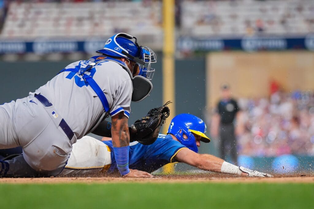 Aug 8, 2025; Minneapolis, Minnesota, USA; Kansas City Royals catcher Salvador Perez (13) tags out Minnesota Twins outfielder Matt Wallner (38) in the sixth inning at Target Field. Mandatory Credit: Brad Rempel-Imagn Images