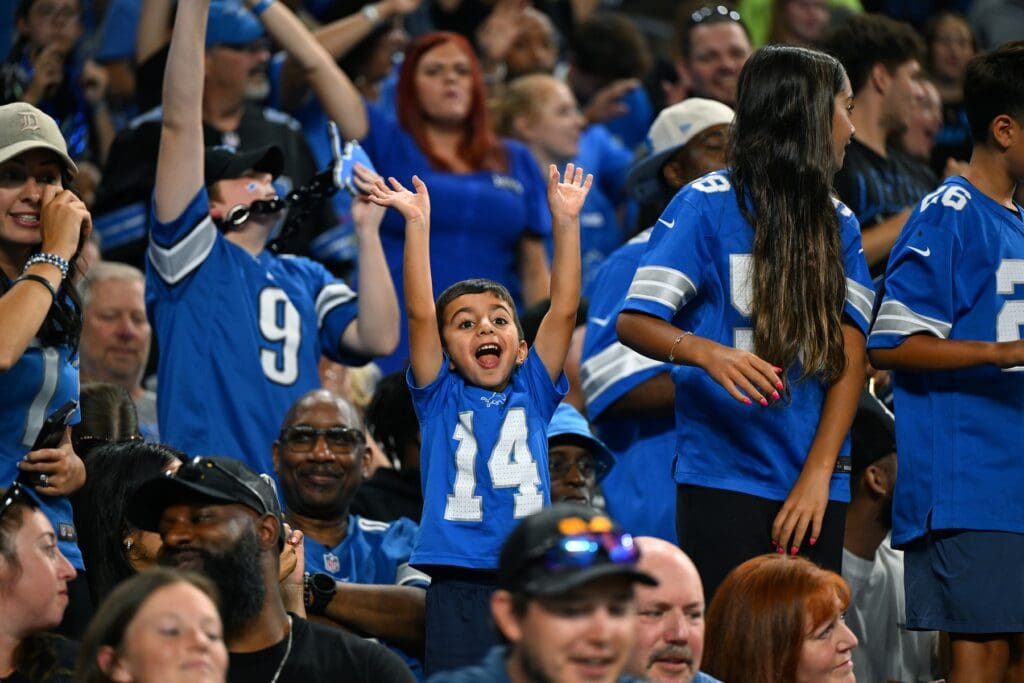 Aug 16, 2025; Detroit, Michigan, USA;  Detroit Lions fans scream for a free t-shirt during their game against the Miami Dolphins at Ford Field. Mandatory Credit: Lon Horwedel-Imagn Images