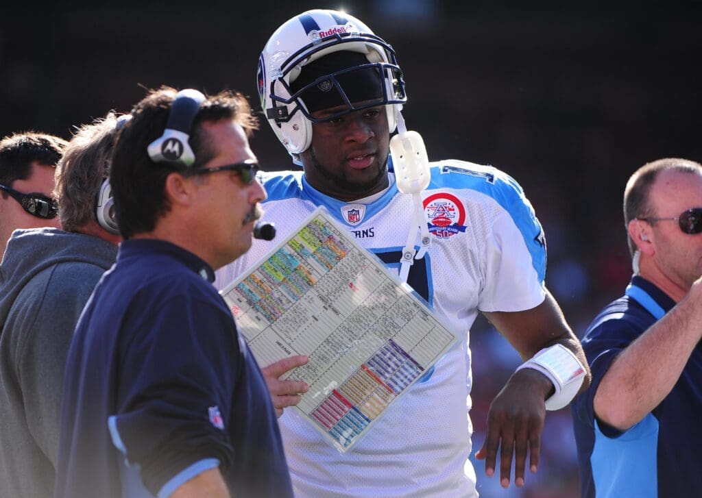 November 8, 2009; San Francisco, CA, USA; Tennessee Titans quarterback Vince Young (10) prepares on the sidelines with head coach Jeff Fisher (left) during the first quarter against the San Francisco 49ers at Candlestick Park. The Titans defeated the 49ers 34-27. Mandatory Credit: Kyle Terada-USA TODAY Sports