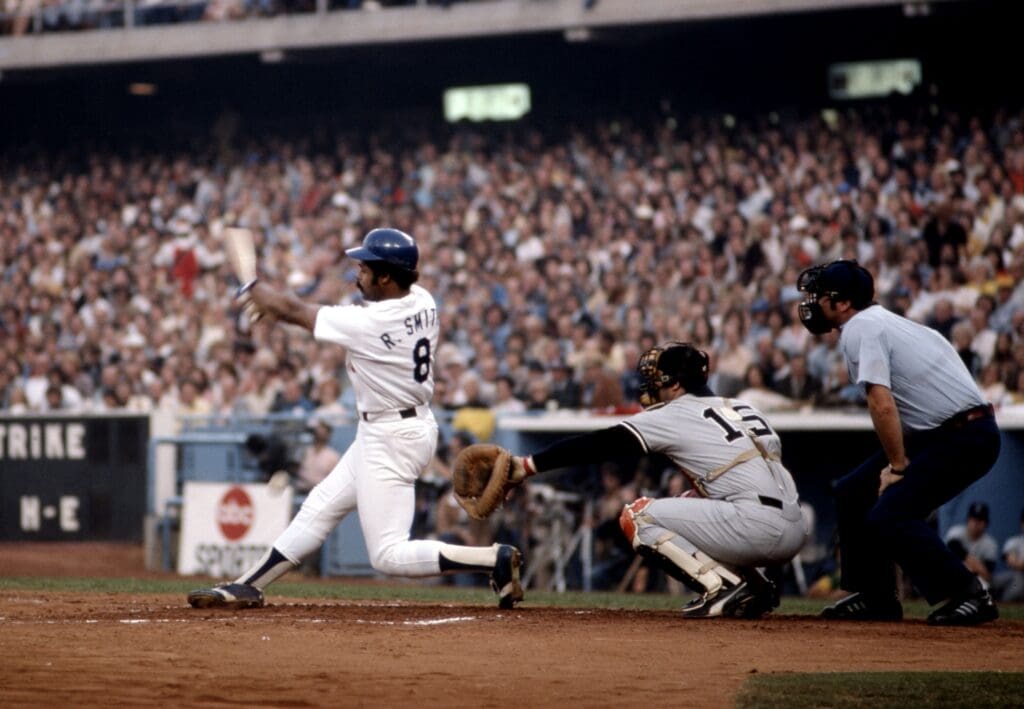 Oct 15, 1977; Los Angeles, CA, USA FILE PHOTO; Los Angeles Dodgers outfielder Reggie Smith (8) at bat in front New York Yankees catcher Thurman Munson (15) in game 4 during the 1977 World Series at Dodger Stadium. The Yankees defeated the Dodgers 4 games to 2. Mandatory Credit: Dick Raphael-USA TODAY Sports