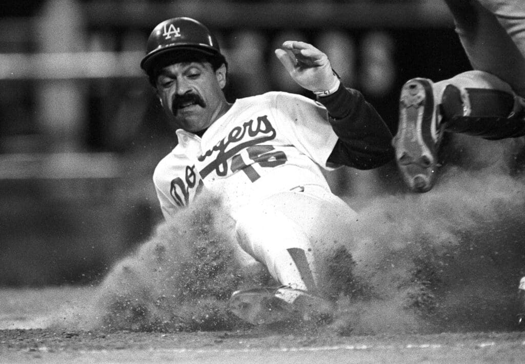 Oct 13, 1981; Los Angeles, CA; USA; FILE PHOTO; Los Angeles Dodgers Davey Lopes (16) slides into 3rd base against the Montreal Expos during the 1981 NLCS at Dodger Stadium. Mandatory Credit: Jayne Kamin-Oncea-USA TODAY Sports