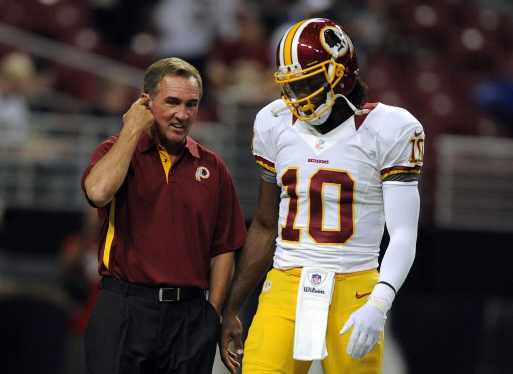 September 16, 2012; St. Louis, MO, USA; Washington Redskins head coach Mike Shanahan talks with quarterback Robert Griffin III (10) before a game against the St. Louis Rams at the Edward Jones Dome. Mandatory Credit: Jeff Curry-USA TODAY Sports