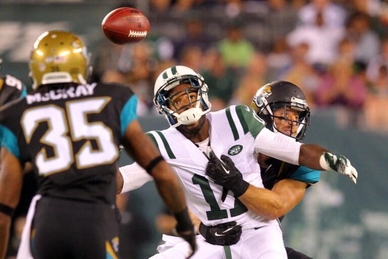 Aug 17, 2013; East Rutherford, NJ, USA; New York Jets wide receiver Braylon Edwards (17) cannot catch a pass while defended by Jacksonville Jaguars safety Chris Prosinski (42) and corner back Demetrius McCray (35) during the third quarter of a preseason game at MetLife Stadium. The Jets defeated the Jaguars 37-13. Mandatory Credit: Brad Penner-USA TODAY Sports