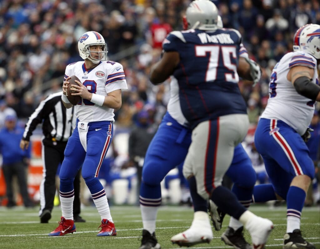 Dec 28, 2014; Foxborough, MA, USA; Buffalo Bills quarterback Kyle Orton (18) looks to pass against the New England Patriots in the first quarter at Gillette Stadium. Mandatory Credit: David Butler II-USA TODAY Sports