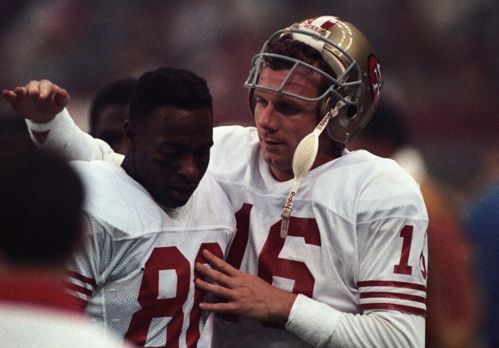 Jan 28, 1990; New Orleans, LA, USA; FILE PHOTO; San Francisco 49ers quarterback Joe Montana (16) with receiver Jerry Rice (80) on the sidelines against the Denver Broncos during Super Bowl XXIV at the Superdome. The 49ers defeated the Broncos 55-10. Mandatory Credit: Bob Deutsch-USA TODAY Sports
