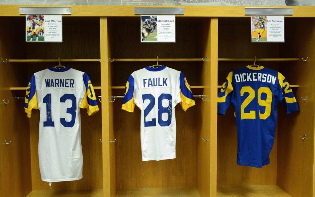 Jun 16, 2016; Los Angeles, CA, USA; Jerseys of St. Louis Rams former quarterback Kurt Warner (13) and running back Marshall Faulk (28) and Los Angeles Rams running back Eric Dickerson (29) at NFL All-Access at the Los Angeles Memorial Coliseum. Mandatory Credit: Kirby Lee-USA TODAY Sports
