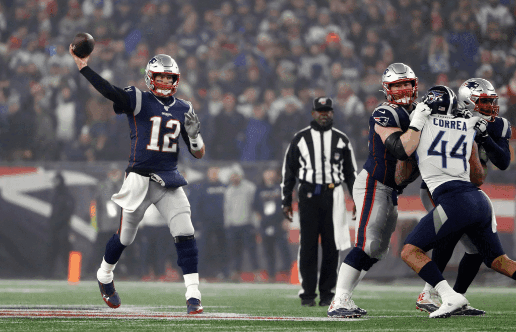 Jan 4, 2020; Foxborough, Massachusetts, USA; New England Patriots quarterback Tom Brady (12) throws during a playoff game against the Tennessee Titans at Gillette Stadium. Mandatory Credit: Winslow Townson-Imagn Images