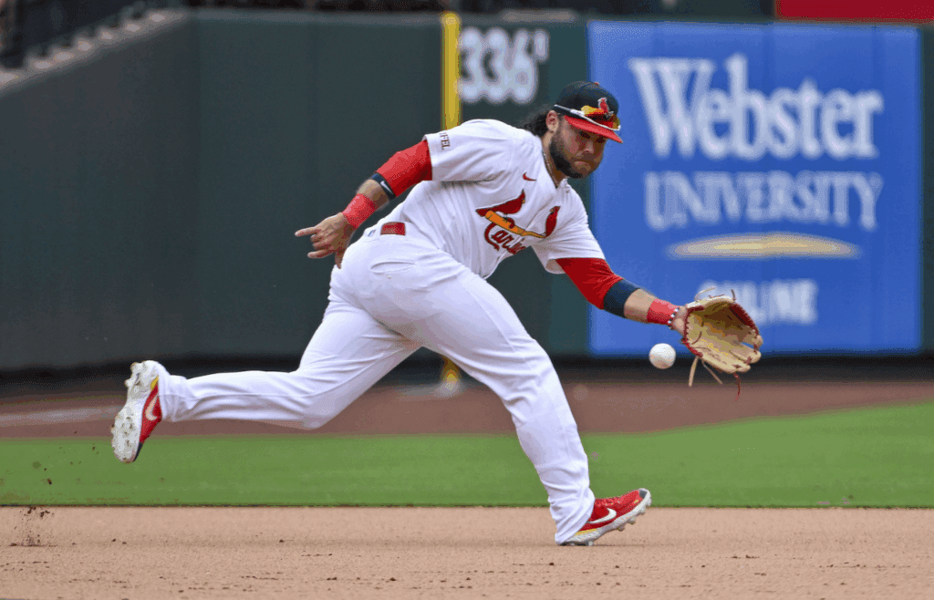 Jul 14, 2024; St. Louis, Missouri, USA; St. Louis Cardinals third baseman Brandon Crawford (35) fields a ground ball against the Chicago Cubs during the eighth inning at Busch Stadium. Mandatory Credit: Jeff Curry-Imagn Images