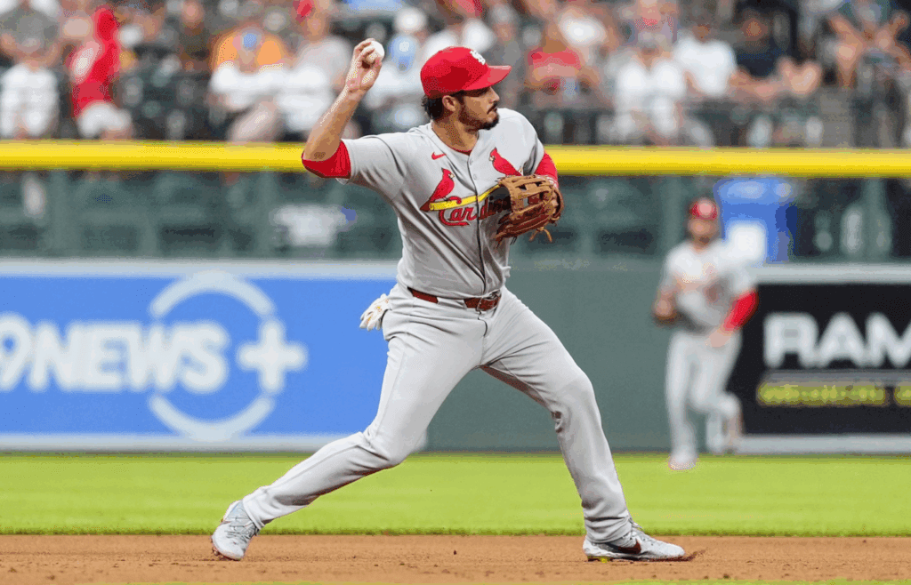 Jul 22, 2025; Denver, Colorado, USA; St. Louis Cardinals third baseman Nolan Arenado (28) fields the ball in the first inning against the Colorado Rockies at Coors Field. Mandatory Credit: Ron Chenoy-Imagn Images