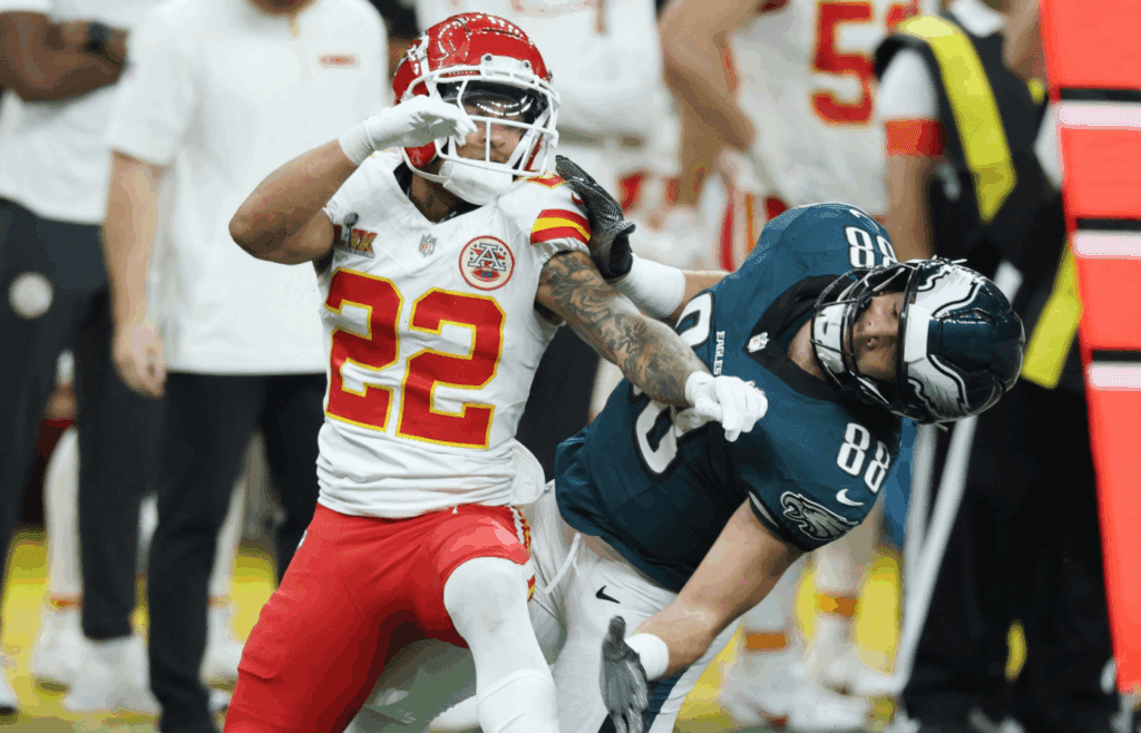 Feb 9, 2025; New Orleans, LA, USA; Kansas City Chiefs cornerback Trent McDuffie (22) and Philadelphia Eagles tight end Dallas Goedert (88) battle for position as they look for the ball in the first quarter in Super Bowl LIX at Ceasars Superdome. Mandatory Credit: Stephen Lew-Imagn Images