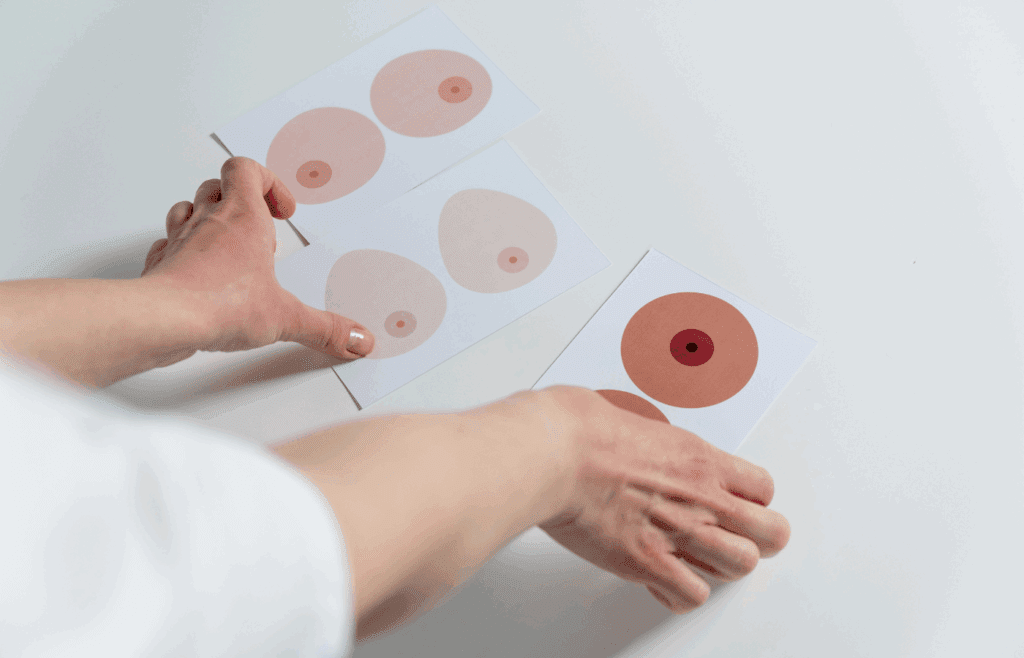 Person reviewing breast enhancement choices