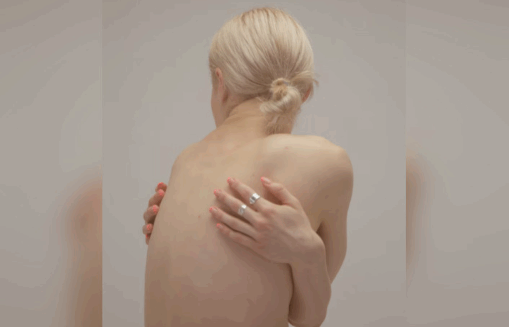 Discomfort from scar tissue around breast implant