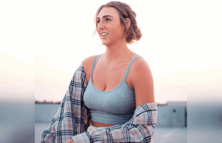 Confident smile on woman in gray tank top