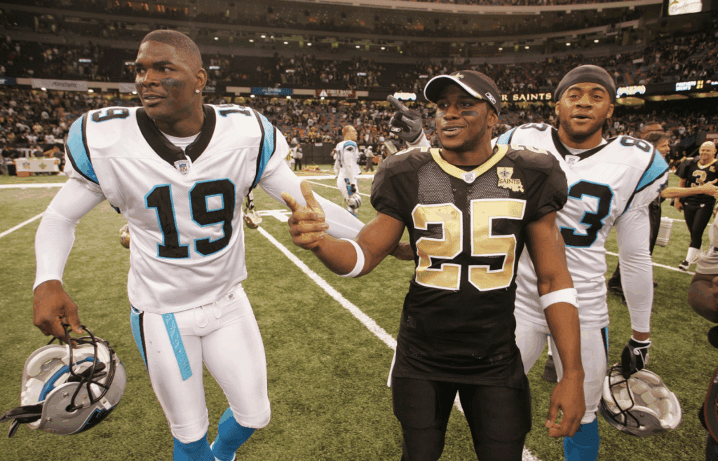 Dec. 31, 2006; New Orleans, LA, USA; New Orleans Saints running back Reggie Bush (25) tries to round up fellow Southern California former football players Carolina Panthers wide receiver Keyshawn Johnson (19) and Keary Colbert (83) at the end of the game. The Saints lost 31-21 to the Carolina Panthers in the Saints final regular season game at the Superdome in New Orleans, LA. Mandatory Credit: John David Mercer-Imagn Images © 2006 John David Mercer