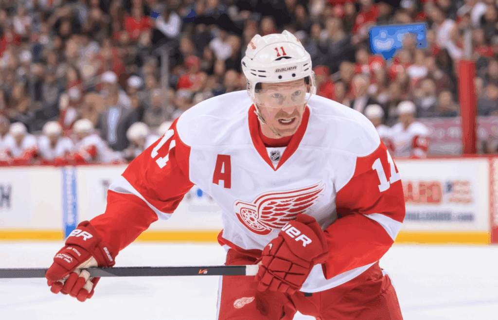 Mar 22, 2014; Saint Paul, MN, USA; Detroit Red Wings right wing Daniel Alfredsson (11) skates after the puck against the Minnesota Wild at Xcel Energy Center. Mandatory Credit: Brad Rempel-Imagn Images