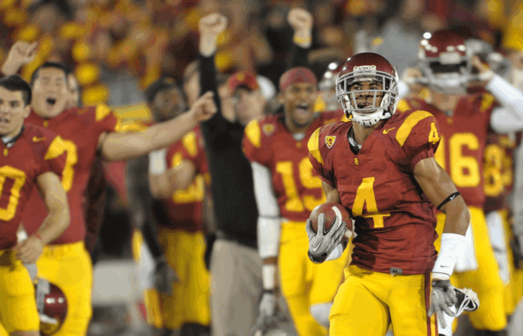 Nov. 6, 2010; Los Angeles, CA, USA; University of Southern California Trojans cornerback Alden Darby (4) runs back a blocked punt for 2 points in the 4th quarter at the Los Angeles Coliseum. USC defeated Arizona State 34-33. Mandatory Credit: Jayne Kamin-Oncea-Imagn Images