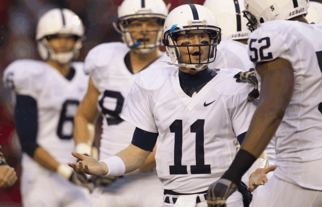 Nov 26, 2011; Madison, WI, USA; Penn State Nittany Lions quarterback Matthew McGloin (11) reacts after being called for a penalty during the second quarter against the Wisconsin Badgers at Camp Randall Stadium. Mandatory Credit: Jeff Hanisch-Imagn Images