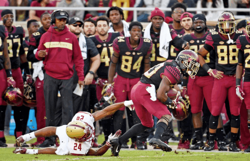 Nov 17, 2018; Tallahassee, FL, USA; Florida State Seminoles wide receiver Keyshawn Helton (20) runs the ball past Boston College Eagles defensive back Taj-Amir Torres (24) during the first half at Doak Campbell Stadium. Mandatory Credit: Melina Myers-Imagn Images
