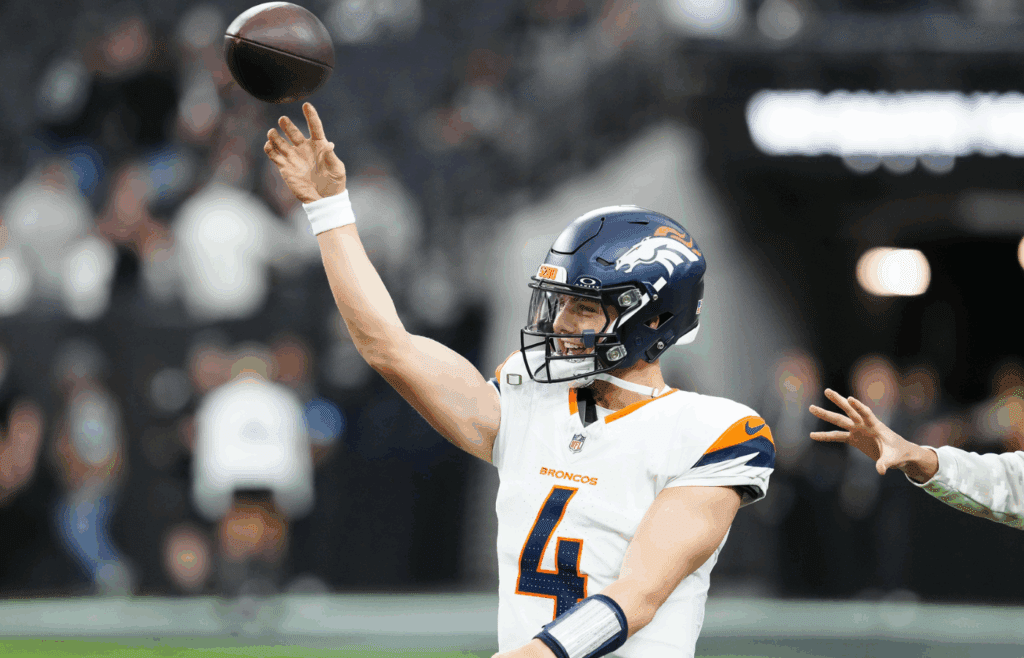 Nov 24, 2024; Paradise, Nevada, USA; Denver Broncos quarterback Zach Wilson (4) warms up before a game against the Las Vegas Raiders at Allegiant Stadium. Mandatory Credit: Stephen R. Sylvanie-Imagn Images