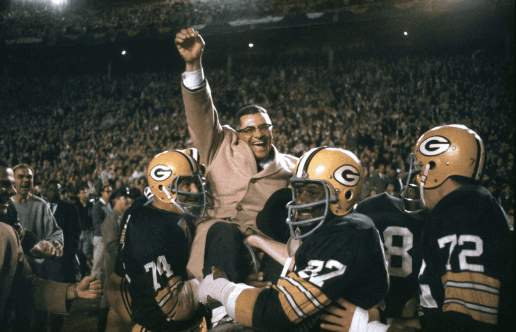 Jan 1, 1967; Dallas, TX, USA; FILE PHOTO; Green Bay Packers head coach Vince Lombardi celebrates as he is carried off the field by defensive tackle (74) Henry Jordan and defensive end (87) Willie Davis after the Packers beat the Dallas Cowboys 34-27 during the 1966 NFL Championship Game at the Cotton Bowl. Mandatory Credit: Tony Tomsic-USA TODAY NETWORK