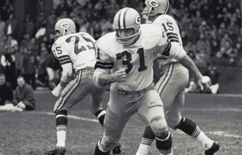 Sep 28, 1964; Detroit, MI, USA; FILE PHOTO; Green Bay Packers running back Jim Taylor (31) in action against the Detroit Lions at Tiger Stadium. Mandatory Credit: Malcolm Emmons-Imagn Images