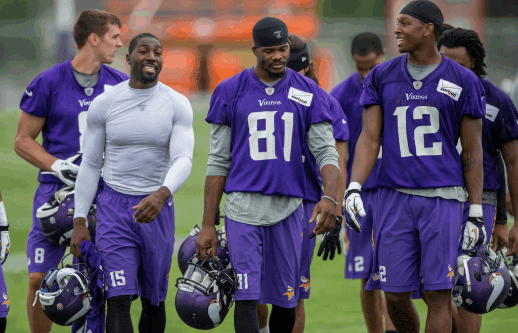 Jul 25, 2014; Mankato, MN, USA; Minnesota Vikings wide receiver Greg Jennings (15) and wide receiver Jerome Simpson (81) and wide receiver Kamar Jorden (12) leave the field at training camp at Minnesota State University. Mandatory Credit: Bruce Kluckhohn-Imagn Images