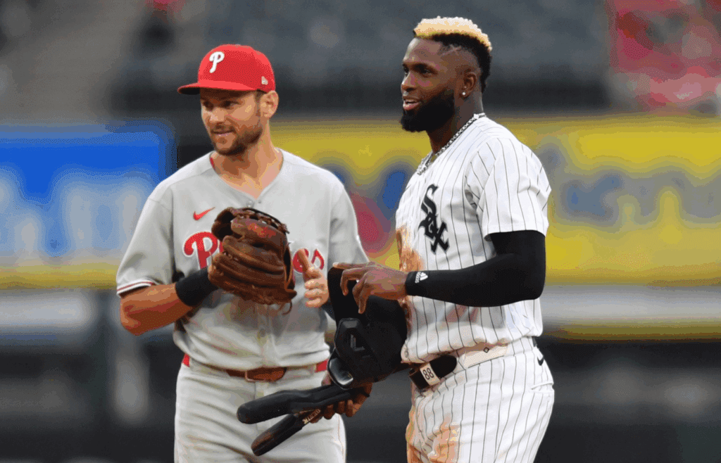 Jul 30, 2025; Chicago, Illinois, USA; Chicago White Sox center fielder Luis Robert Jr. (88) smiles next to Philadelphia Phillies shortstop Trea Turner (7) during the sixth inning at Rate Field. Mandatory Credit: Patrick Gorski-Imagn Images