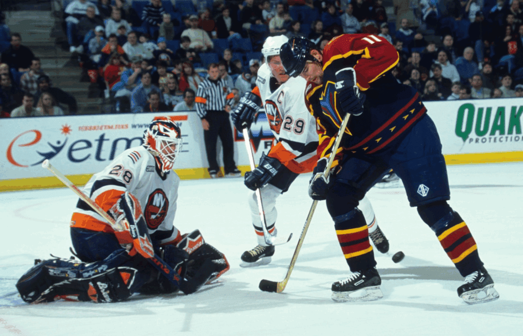 Unknown Date, 1999; Uniondale, NY, USA; FILE PHOTO; Atlanta Thrashers right wing Dean Sylvester (11) in action against New York Islanders goalie Felix Potvin (28) and Kenny Jonsson (29) at Nassau Veterans Memorial Coliseum. Mandatory Credit: Lou Capozzola-USA TODAY NETWORK