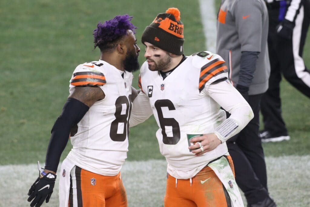 Jan 10, 2021; Pittsburgh, PA, USA; Cleveland Browns quarterback Baker Mayfield (6) celebrates with wide receiver Jarvis Landry (80) on the sideline against the Pittsburgh Steelers in the fourth quarter of an AFC Wild Card playoff game at Heinz Field. Mandatory Credit: Charles LeClaire-USA TODAY Sports